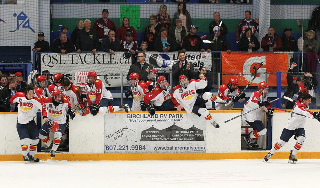 <p>FLEETING IMAGE- The Wellington Dukes pour off their bench after winning the 2018 Dudley Hewitt Cup in Dryden, ON. The Dukes have been stripped of hosting the 2020 Dudley Hewitt Cup Championships after the Canadian Junior Hockey League levied sanctions agaisnt the Ontario Junior Hockey League for allowing trades after the Hockey Canada Jan. 10 roster deadline. (Photo by Tim Bates/DHC via OJHL Images)</p>
