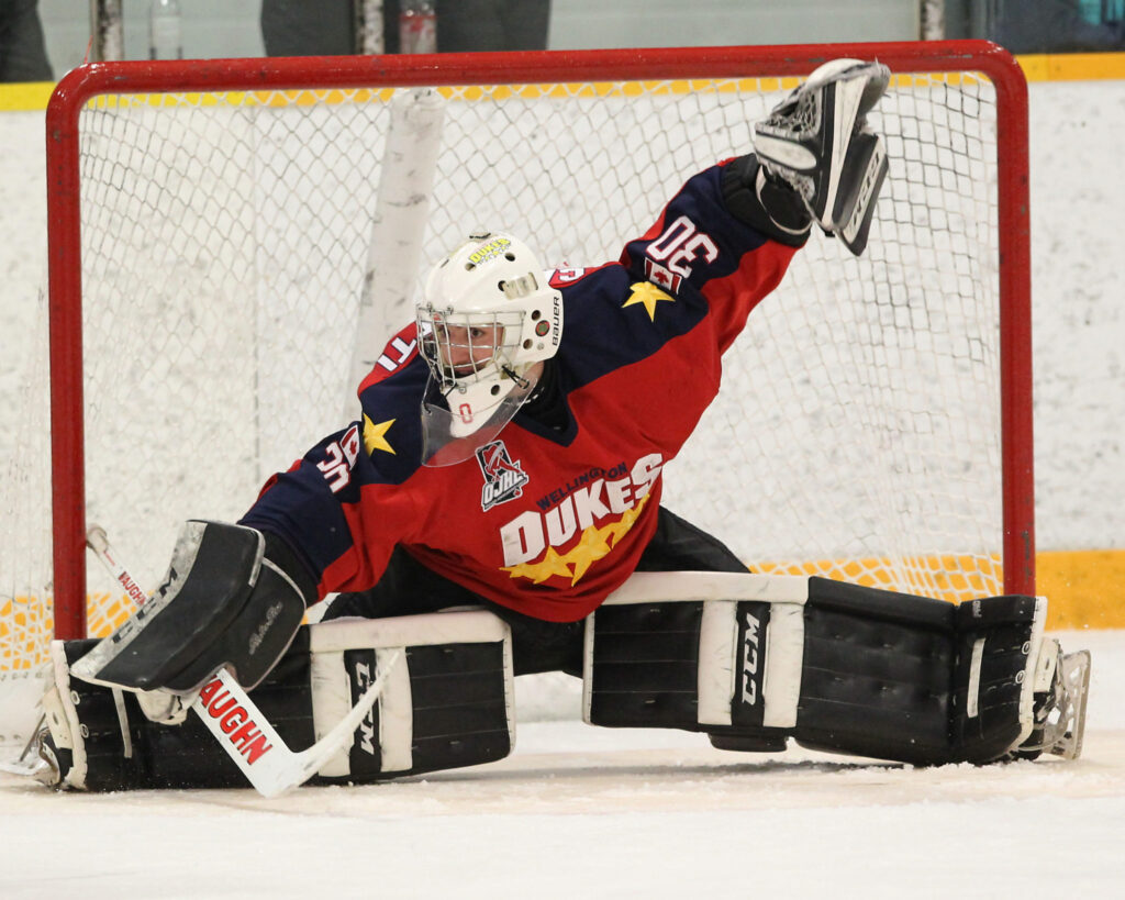 <p>Wellington Dukes netminder Jonah Capriotti slides to make a save during the third period of his team’s 6-3 win over the Cochrane Crunch Thursday afternoon at the 2018 Dudley Hewitt Cup in Dryden, ON. (Photo by Tim Bates/DHC via OJHL Images)</p>
