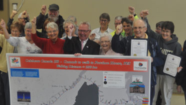 <p>Accomplishment – Mayor Robert Quaiff and councillor Jim Dunlop celebrate with those who successfully completed the County’s third walking challenge Monday afternoon in Wellington. (Adam Bramburger/Gazette staff)</p>
