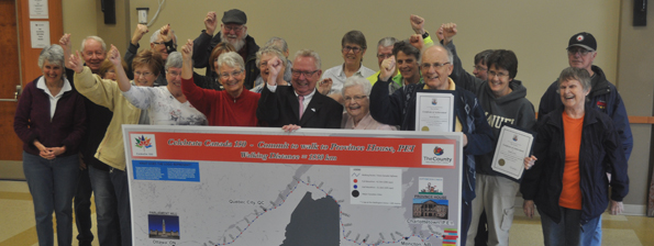 <p>Accomplishment – Mayor Robert Quaiff and councillor Jim Dunlop celebrate with those who successfully completed the County’s third walking challenge Monday afternoon in Wellington. (Adam Bramburger/Gazette staff)</p>
