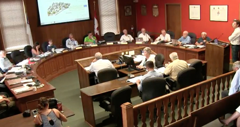 <p>Seeking support – Prince Edward County Affordable Housing Network spokesperson Anthony Lemke shares the group’s vision for the former Wellington arena site with County councillors Thursday. (www.thecounty.ca)</p>
