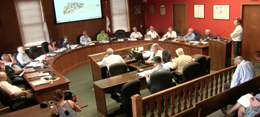 <p>Seeking support – Prince Edward County Affordable Housing Network spokesperson Anthony Lemke shares the group’s vision for the former Wellington arena site with County councillors Thursday. (www.thecounty.ca)</p>
