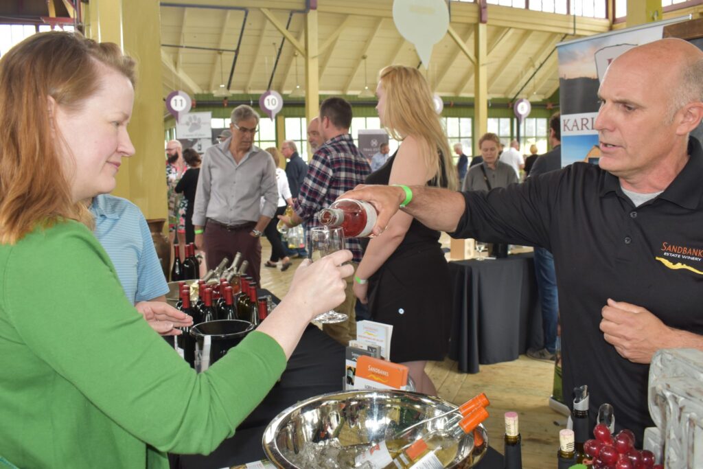 <p>NEW SERVING- Tom Hall of Sandbanks Estate Winery serves up some rose at PECWA’s 2018 Terroir event at the Crystal Palace Saturday. (Jason Parks/Gazette Staff)</p>
