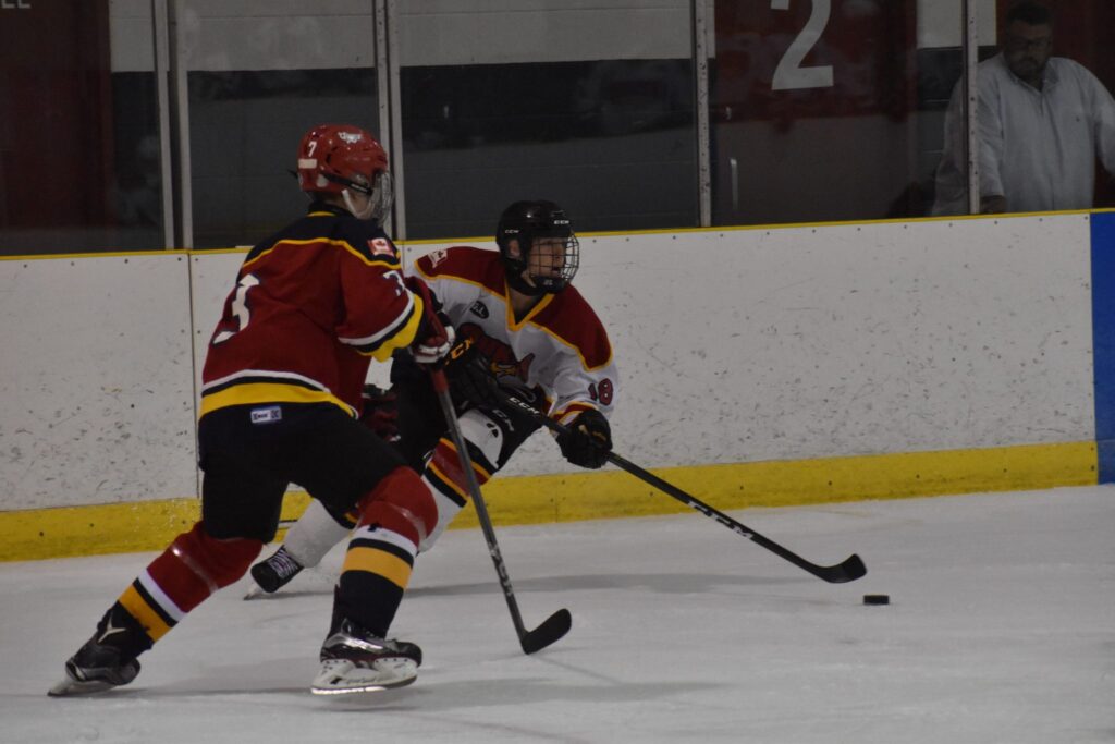 <p>CAMPERS-  Forward Garrison Moore tries to get past Quinte Red Devils product Cooper Rogers at the 2018 Wellington Dukes spring camp. (Jason Parks/Gazette File Photo)</p>
