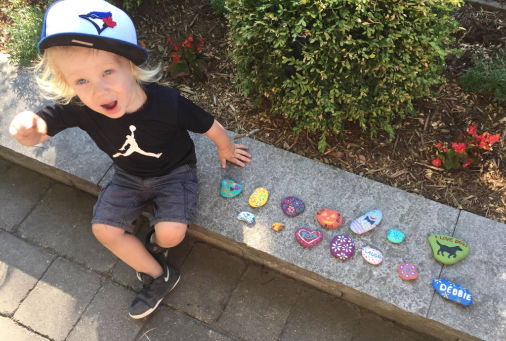 <p>WHAT A FIND- Romeo Bellissimo shows off some the painted rocks he found at Picton’s Cenotaph earlier this month. The PEC Rocks Facebook page has over 1,000 members that regularly hide scores of colourful rock creations all over Prince Edward County. (Facebook Photo)</p>
