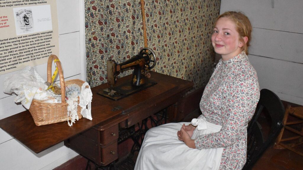 <p>A STITCH IN TIME- Rose House Museum attendant Shannon Andrews at the antique sewing machine display.<br />
(Jason Parks/Gazette Staff)</p>
