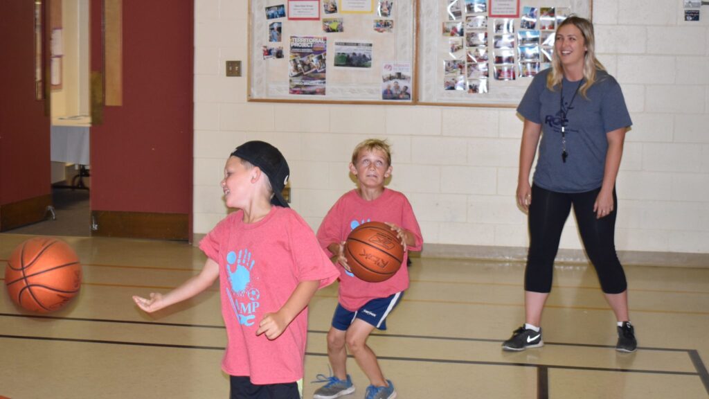<p>ON THE BALL- Camp ROC  Participants (from left) Mason Lloyd and Ryker Wood play around of bump basketball while under the supervision of ROC Program Facilitator Lindsay Ferguson. (Jason Parks/Gazette Staff)</p>
