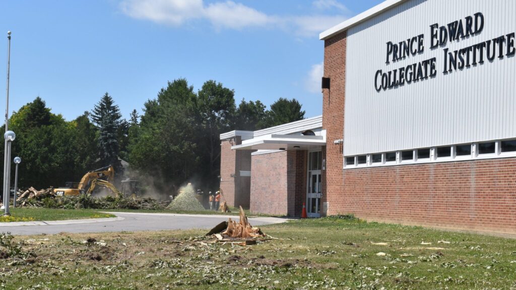 <p>AT WORK- Cooney Excavating team members work at clearing the front of PECI in advance of a $370,000 make over to be completed prior to the start of the 2018 school year. (Jason Parks/Gazette Staff)</p>
