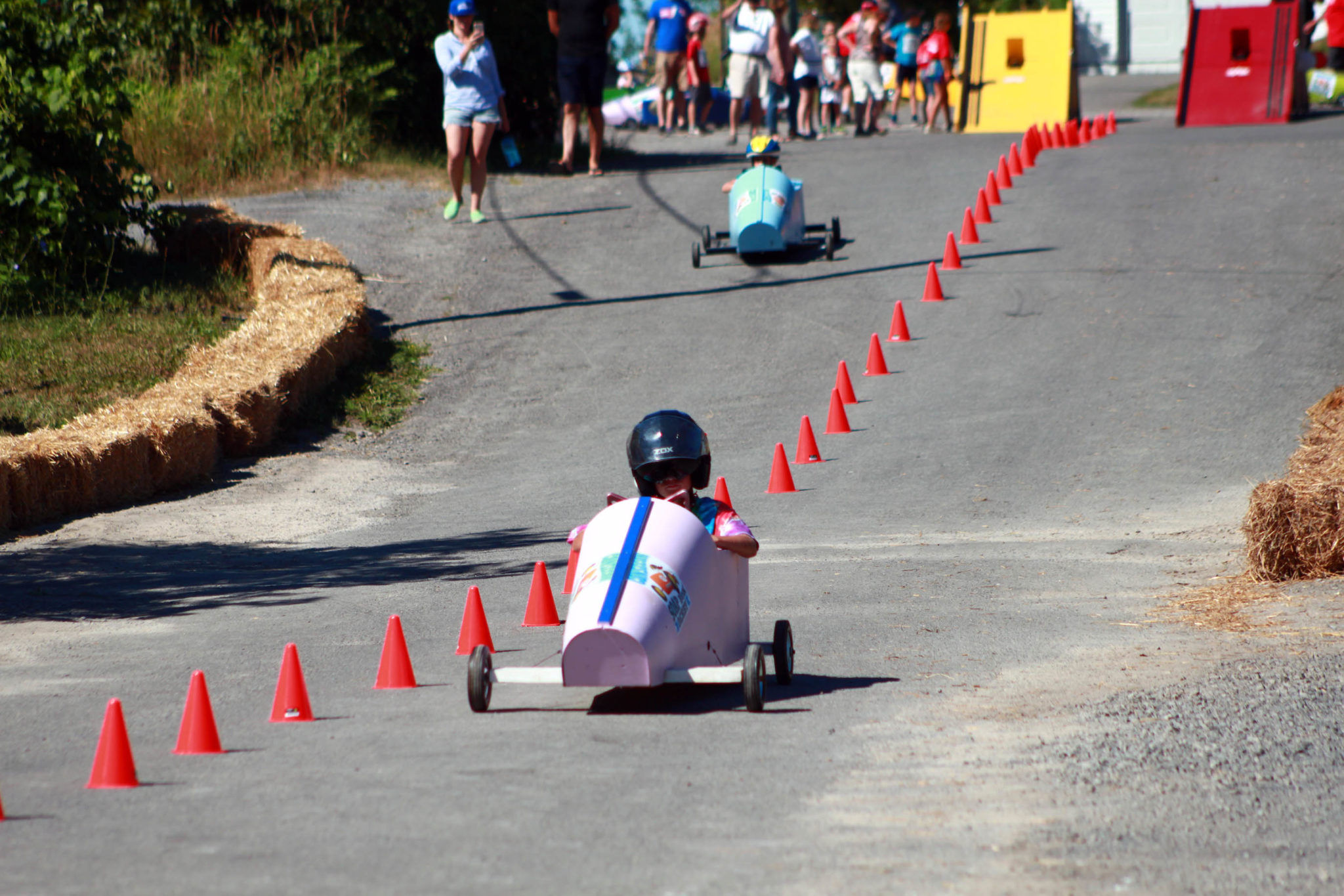 <p>Leo Hynes falls behind Liam Ackerman in their race down the hill Saturday. (Chad Ibbotson/Gazette staff)</p>
