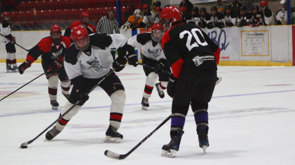 <p>Ethan Ashley tries to drag a shot around defender Chase Lavender on Monday night. It was the Pirates’ first skate of their main camp. They skated again Tuesday evening and will be back on the ice Thursday night in Wellington from 7:30–9:30 p.m. The club will play their first exhibition game of the season at North Kawartha Friday night at  7:30 p.m. The teams will face off again on Sunday, Aug. 26 at 3 p.m. at Essroc Arena. (Chad Ibbotson/Gazette staff)</p>
