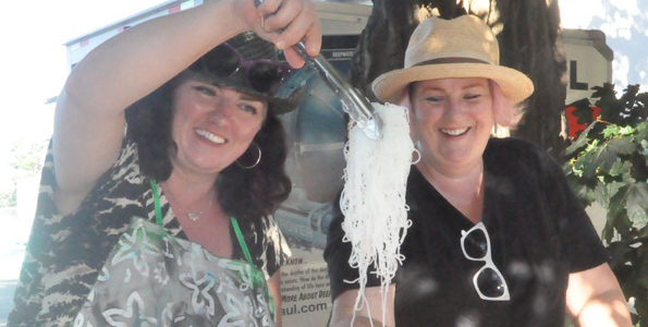<p>Food to offer – Susanne Larner, left, and Krista Dalby serve noodles during the original Feast! in 2016. Food Not Bombs plans to bring a similar event back to Benson Park this Sunday. (Adam Bramburger/Gazette staff)</p>
