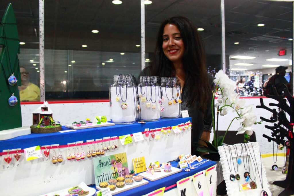 <p>Vendor Melis Kalemdaroglu showcases her handcrafted miniatures last Thursday. (Chad Ibbotson/Gazette staff)</p>
