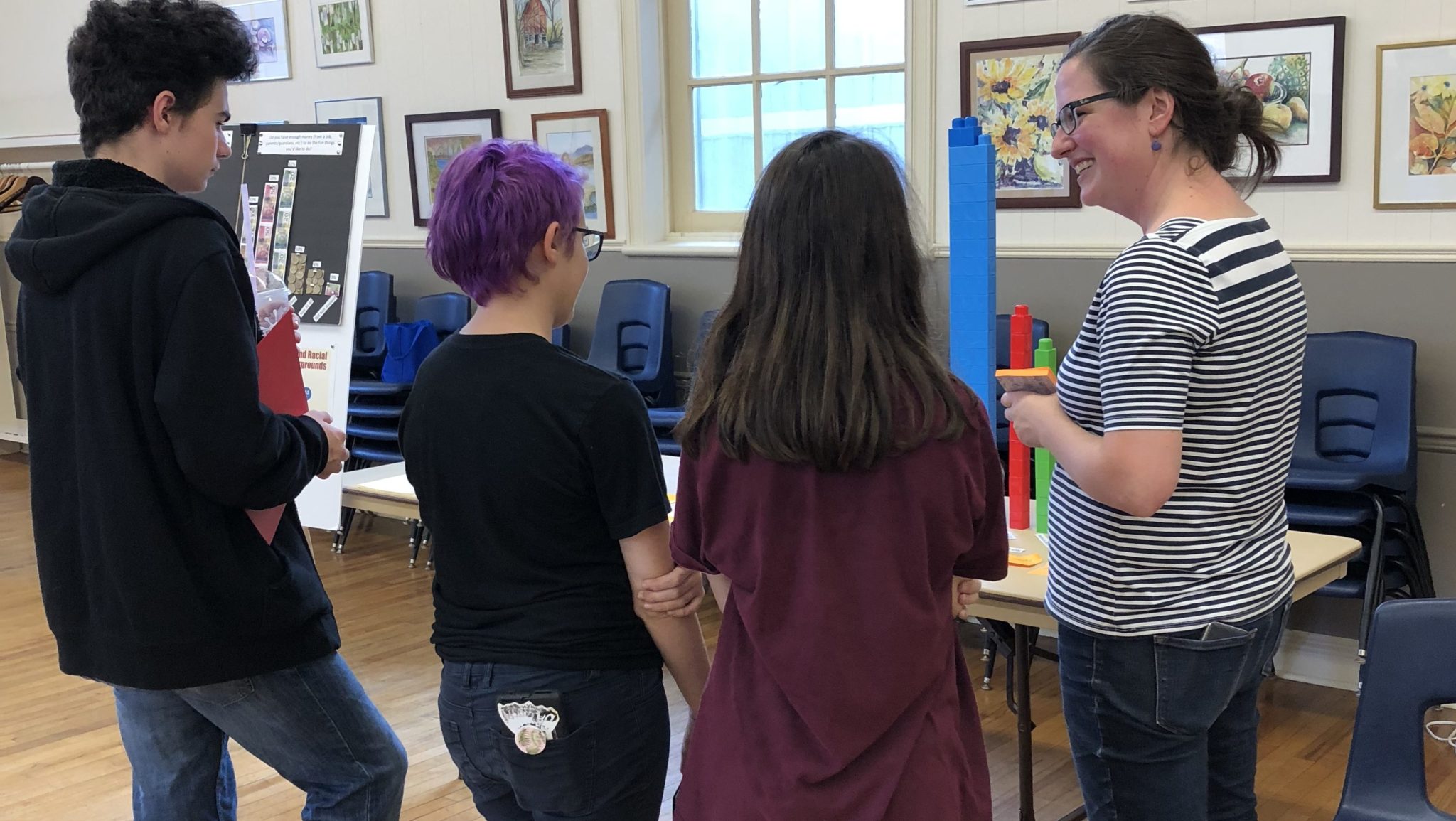 <p>SAVE THE DATA- (Right) Kristin Wheatcroft of the County Foundation speaks with local youth at the Greater Than County Youth Collective data release party at St. Mary Magdalene Hall on Wednesday afternoon. (Submitted Photo)</p>
