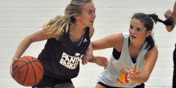 <p>Matching up –  Vanessa Wilton carries the ball as teammate Hannah Goad tries to take away space for her to attack during the PECI Junior Basketball Panthers’ practice Monday. (Adam Bramburger/Gazette staff)</p>
