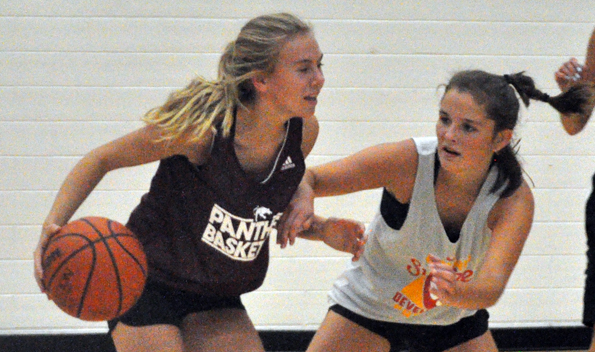 <p>Matching up –  Vanessa Wilton carries the ball as teammate Hannah Goad tries to take away space for her to attack during the PECI Junior Basketball Panthers’ practice Monday. (Adam Bramburger/Gazette staff)</p>
