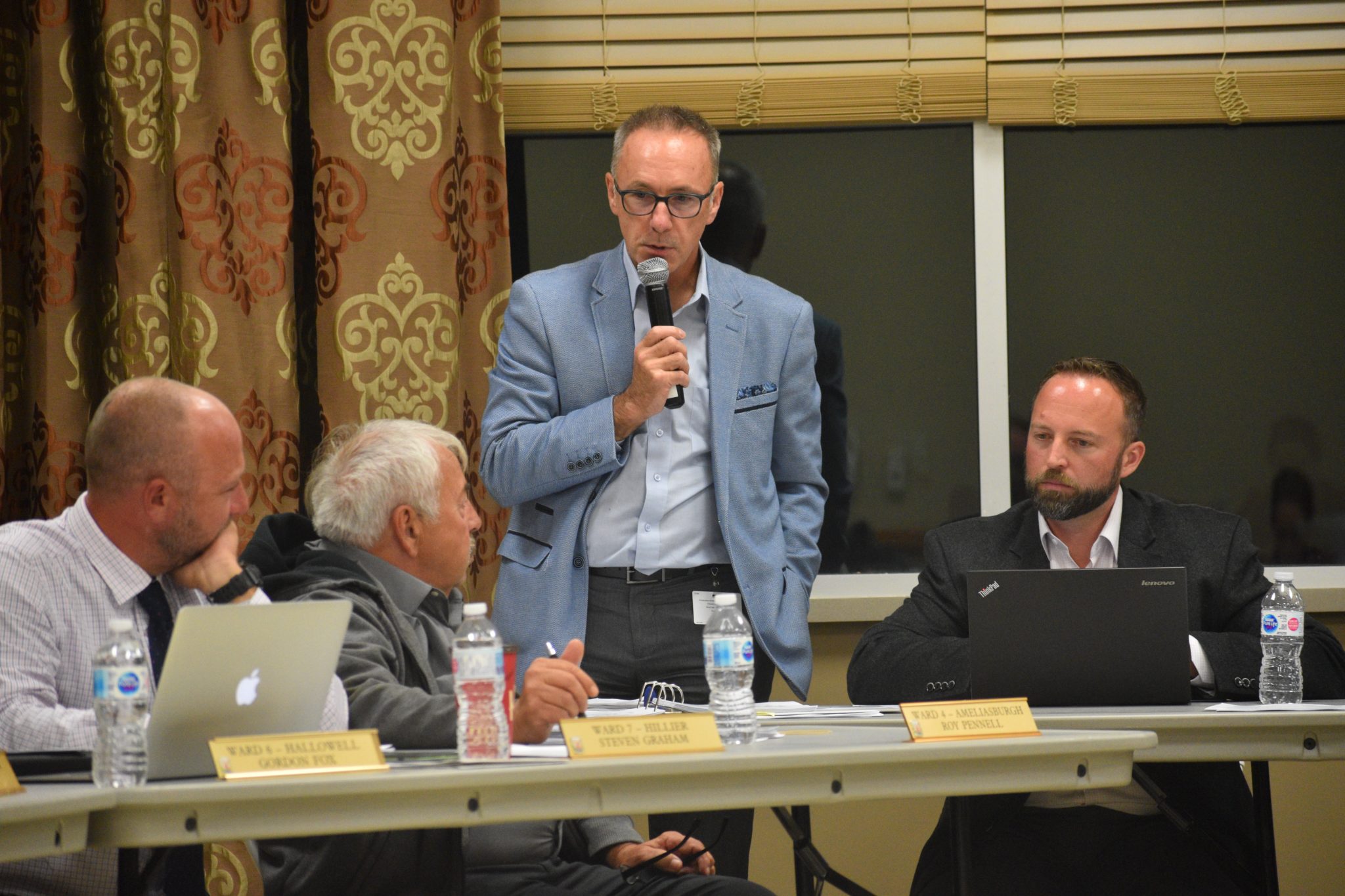 <p>IN THE SHORT TERM- County of Prince Edward Manager of Planning Paul Walsh speaks to the Short Term Accommodation draft amendment and bylaw Monday evening. Also pictured are (from left) Councillors Steve Graham and Roy Pennell and consultant Greg Bender. (Jason Parks/Gazette Staff)</p>
