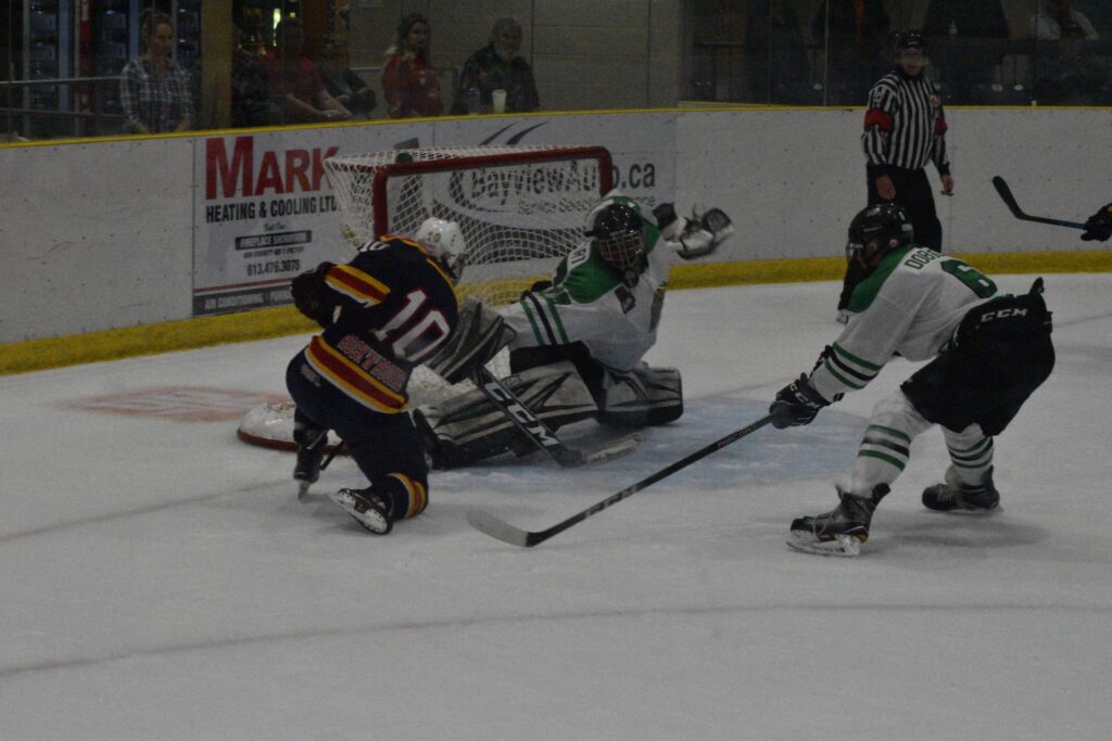 <p>FOILED- Cobourg Cougar net minder Dershahn Stewart gets over to rob Wellington’s Adam Usinger in the first overtime of the Dukes’ 5-4 win Friday night at Lehigh Arena. (Jason Parks/Picton Gazette)</p>
