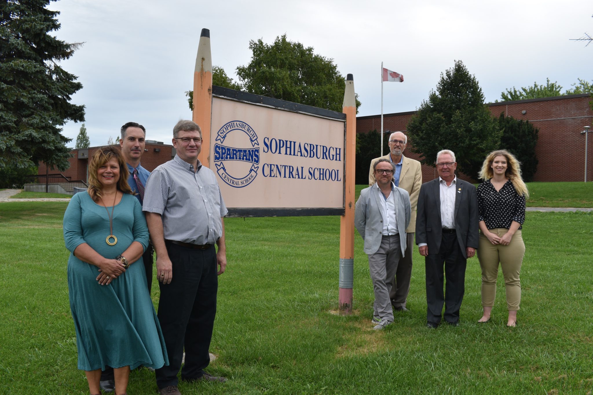 <p>A NEW DAY DAWNING- Stakeholders in the Prince Edward County Food Hub Project join in front of the Sophiasbrugh Central School sign on Thursday. (Jason Parks/ Gazette Staff)</p>
