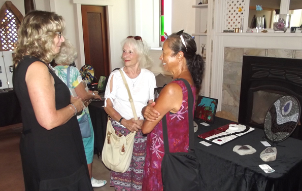 <p>Chatting with a creator- The garden mosaic items on the right are the work of artist  Karen Rickey (left) of Belleville, shown chatting with Rednersville Road Art Tour visitors Lorna Potts and Shelley Dornellas (right), both of Belleville, on Labour Day weekend. (Terry McNamee/For The Gazette)</p>
