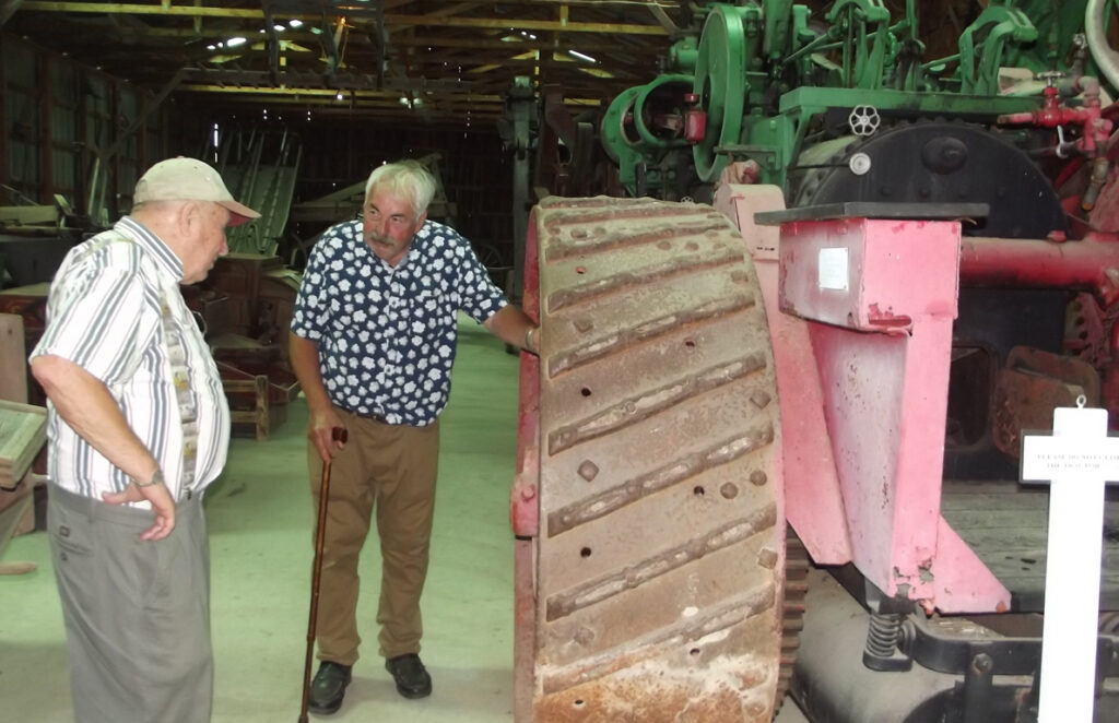 <p>Enduring reminder – This massive Case 30-horsepower steam tractor brought back memories for Bill Rose (left) of Bloomfield and Roy Pennell of Ameliasburgh as they attended the 50th anniversary event at Ameliasburgh Heritage Village on Sunday, Sept. 2. (Terry McNamee/For The Gazette)</p>
