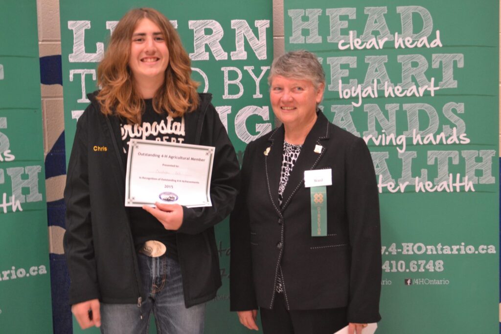 <p>OUTSTANDING IN HER FIELD- (Right) Lynn Ward presents an award to Chris Bell at the 2015 Prince Edward County 4H awards. Ward has been selected to join the honourees at Farmtown Park’s Quinte Agricultural Wall of Fame next weekend. (Jason Parks/Gazette file photo)</p>
