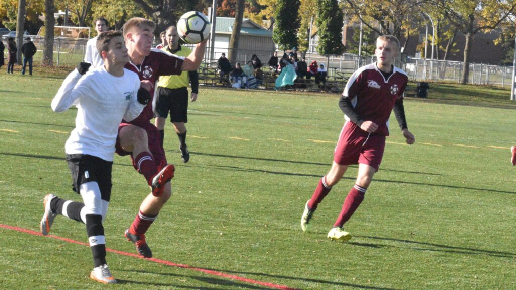 <p>PECI’s Gabe Goad battles for the ball against a Nicohlson Crusader while teammate Bruce Reynolds looks on. PECI dropped its Bay of Quinte Semi Finals match up on Thursday to NCC 1-0. (Jason Parks/Gazette Staff)</p>
