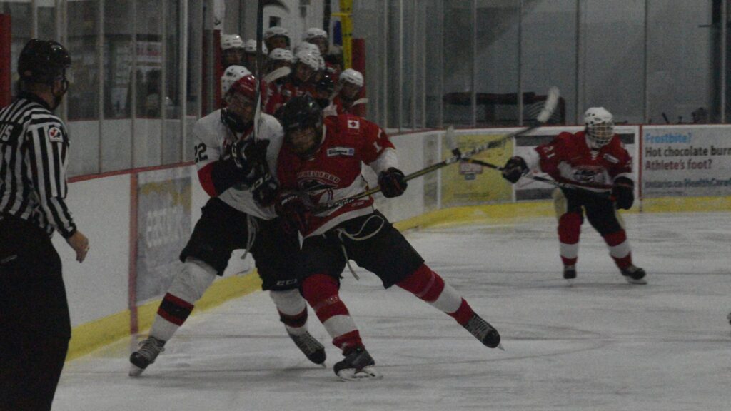 <p>SOFTENING THE BLOW- Picton Pirate Nate Boomhower absorbs a check from Campbellford Rebel Dakota Ball during Picton’s 15-0 win Thursday night at Huff Estates Arena. (Jason Parks/Gazette Staff)</p>
