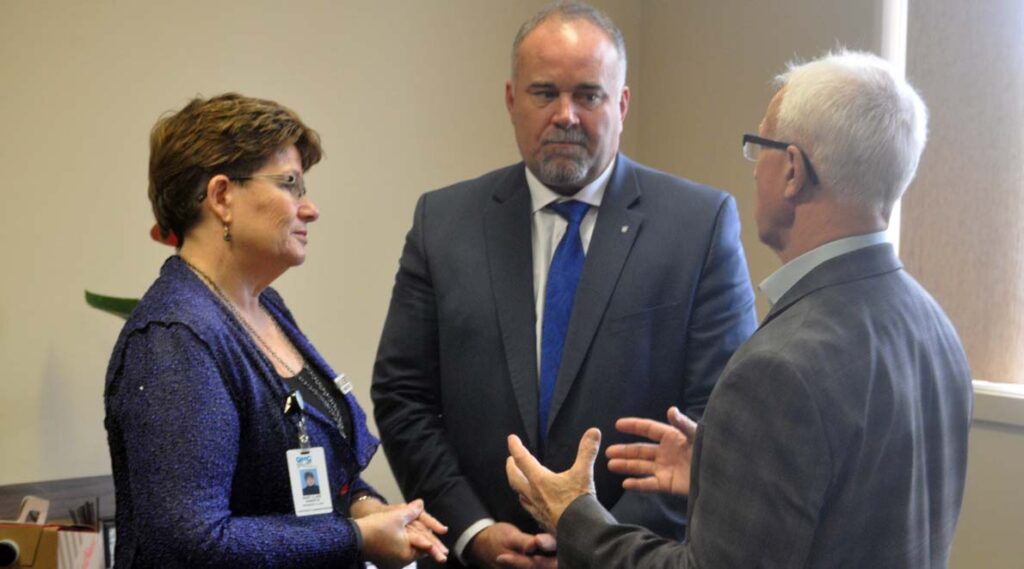 <p>Supporting the system – Quinte Healthcare Corporation president and chief executive officer Mary Clare Egberts, Bay of Quinte MPP Todd Smith, and South East Local Health Integration Network president and chief executive officer Paul Huras discuss Ontario’s health-care system after Smith announced $2.8 million in one-time surge funding to help QHC support an additional 23 beds through the fiscal year. (Adam Bramburger/Gazette staff)</p>
