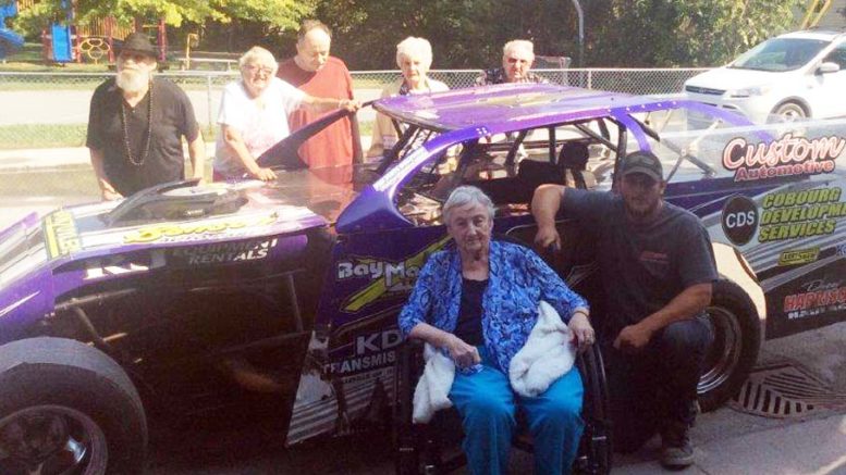 <p>Brighton Speedway dirt champion Andrew Hennessey recently visited Kentwood Park Nursing Home to show excited residents his stock car. Hennessey was kind enough to pose for photos with any resident who asked and he also revved up his engine to  let them hear how loud it could go.  (Submitted photo)</p>

