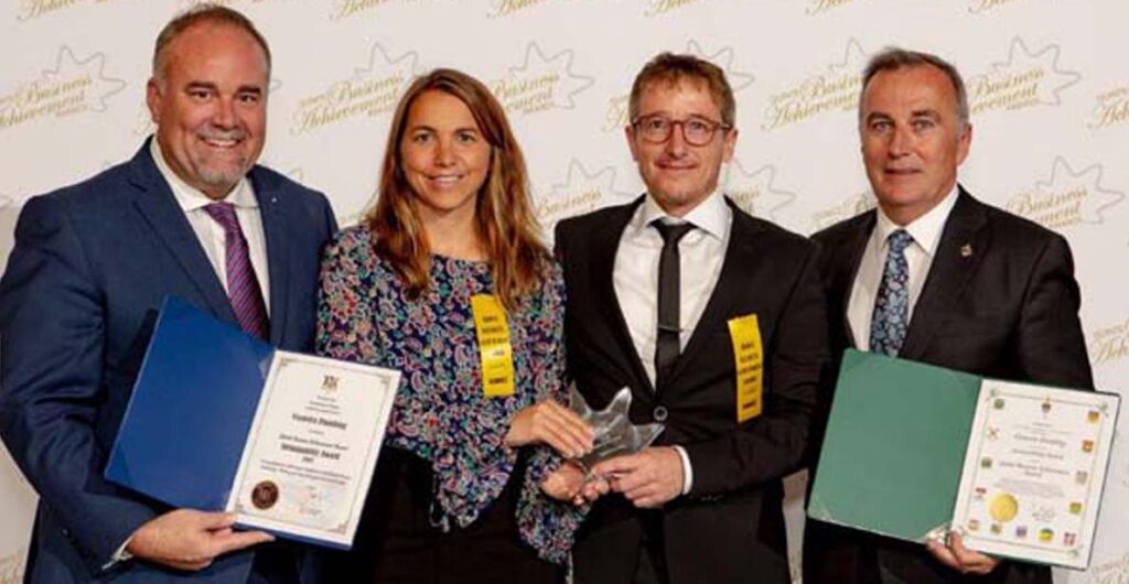 <p>Promoting sustainability – Bay of Quinte MPP Todd Smith, left, and MP Neil Ellis present the sustainabilty award to Jen and Chris Walcott of Veenstra Plumbing at Friday’s ceremony. (Quinte Business Achievement Awards)</p>
