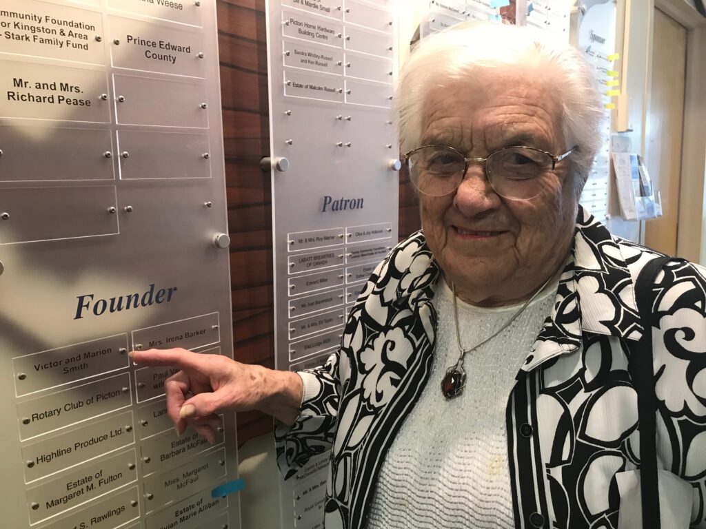 <p>A LASTING LEGACY- Marion Smith points to her name plate on the donor wall erected by the Prince Edward County Memorial Hospital Foundation to honour those who have supported efforts to equip the facility with the latest medical equipment. (Submitted Photo)</p>
