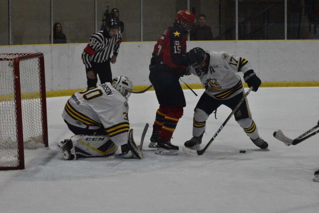 <p>ALL EYES ON ME- Whitby Fury defenceman Amedeo Mastrangelli and netminder Luke Pearson keep an eye on the puck underneath the skates of Wellington Duke Andrew Rinaldi as OHA official Justin Kuipers looks on. Wellington was shut out on home ice by the visiting Fury 4-0 Friday. (Jason Parks/Gazette Staff)</p>
