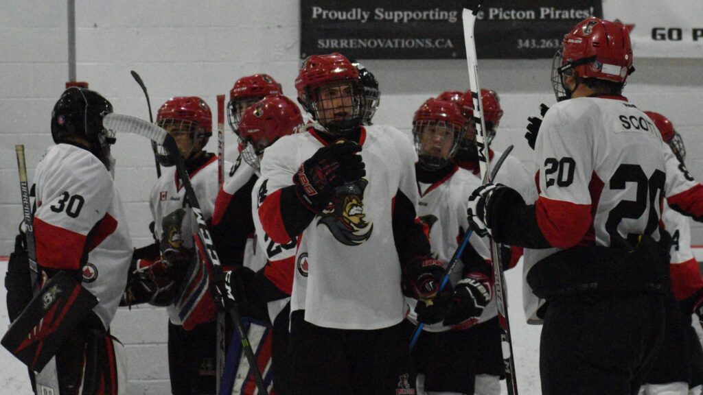 <p>PUT IT ON THE BOARD- Picton Pirates (left) Logan White and (right) Matt Scott celebrate their club’s 2-1 win over visiting Gananoque Thursday night. (Jason Parks/Gazette Staff)</p>
