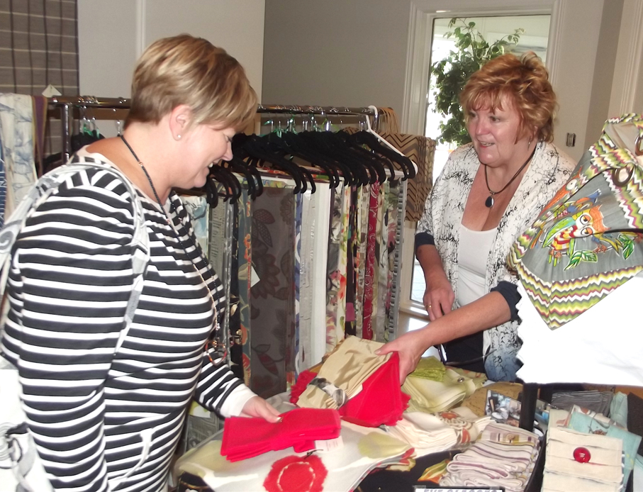 <p>Examining the goods  -Nancy Stroud, left, of Belleville was examining sets of napkins made by Jill Artibello, right, of Seasons & Occasions of Peterborough during the annual craft sale on Saturday (Terry McNamee/For The Gazette)</p>
