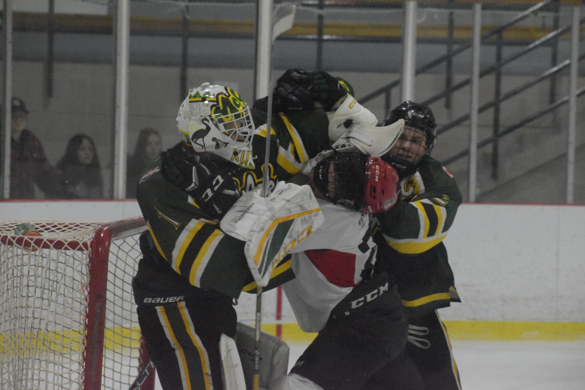 <p>FEELING THE MOJO- Port Perry Mojacks net minder Corey Kuypers and Picton Pirates forward Shaw Boomhower get tangled up as Mojacks captain Dan Harris helps his goalie. Picton bested the visiting Mojacks 5-2 on Saturday night. (Jason Parks/Gazette Staff)</p>
