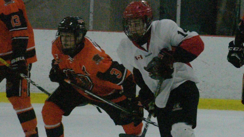 <p>Picton Pirate Logan White battles North Kawartha Knights defenceman Zack Pearson during Picton’s 6-3 loss to North Kawartha Sunday night. (Jason Parks/Gazette Staff)</p>

