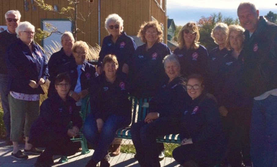 <p>The Picton Kinette Club recently donated $2,500 to dedicate a bench at the Picton Splash Pad.  The inscription reads “In loving memory of Bea Reynolds and Gerry McNamee. Pictured with splash pad committee members Scott Wentworth, left, and Phil St. Jean, right are Kinettes, back row from left: Catherine McGinnis, Jean Thompson, Bette MacDonald, Diane Torney, Dorothy Benbow, Sandra Hoekstra, Susan Eastbury, and Barbara Kennedy.  Front row, from left: Gayle Osborne, Kerry Reynolds, Judy McNamee, and Aynsley Osborne. (Submitted photo)</p>
