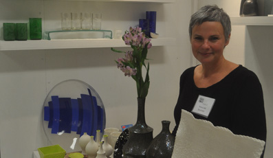 <p>STAYING AT HOME – Michelle Kosoy shows off some of her clay work and husband Pierre Bouchard’s glass work at last year’s Maker’s Hand.  (Adam Bramburger/Gazette file photo)</p>
