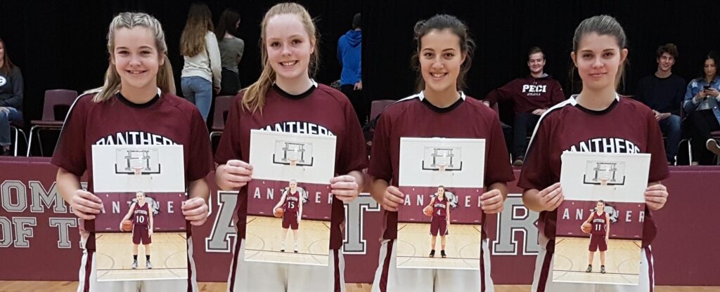 <p>Honoured hoopsters – The PECI Senior Basketball Panthers celebrated graduating players, from left, Mikayla Leavitt, Chloe Marshall, Jessie Swackhammer, and Emma Lemorre Tuesday before defeating the Nicholson Crusaders. (Submitted photo)</p>
