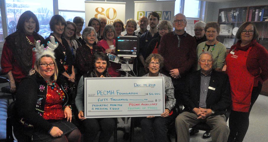 <p>Major gift  – The Prince Edward County Memorial Hospital Auxiliary presented the Prince Edward County Memorial Hospital Foundation $50,000 Friday following a successful Festival of Trees .The groups also witnessed a demonstration of a $22,668 pediatric monitor purchased from those funds. (Adam Bramburger/Gazette staff)</p>
