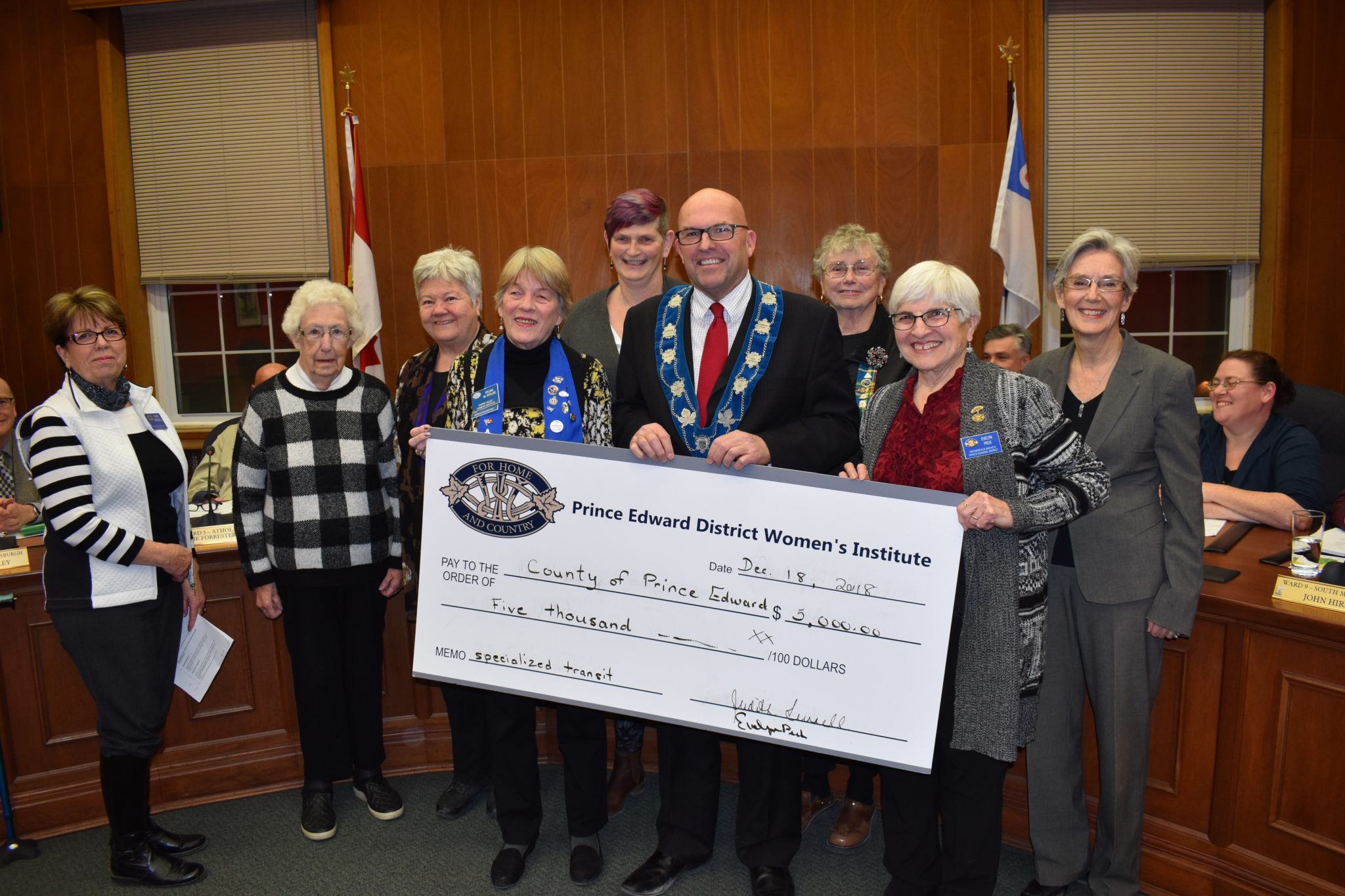 <p>ALL ABOARD- Prince Edward County Mayor Steve Ferguson accepts a cheque from members of the Prince Edward District Women&#8217;s Institute at Shire Hall on Tuesday evening. The funds help offset the costs of providing accessible public transportation in Prince Edward County. (Jason Parks/Gazette Staff)</p>
