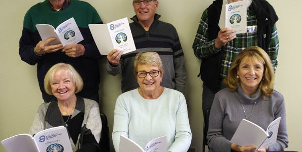 <p>Updated directories -Members of the Prince Edward County Community Care for Seniors Association board of directors peruse the latest edition of their annual resource directory. (Submitted photo)</p>
