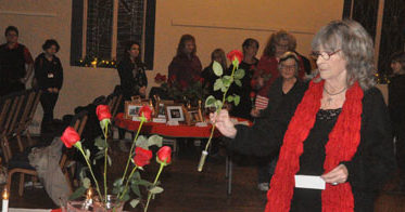 <p>Tribute – Participants in a candlelight vigil at St.Andrew’s Presbyterian Church Dec. 6 laid roses in memory of victims of violence against women. (Adam Bramburger/Gazette staff)</p>
