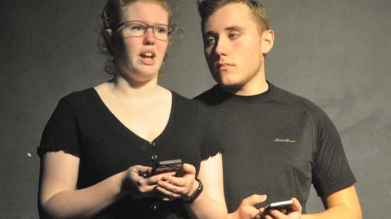<p>Uncomfortable – Aaron Wiik’s character gets a little too close to Alanna Wolfe’s character during a portion of “Boys Will Be Boys” that was based on students’ actual experiences with unwanted attention. The students took part in the school’s eighth annual effort to raise awareness and encourage equality. (Adam Bramburger/Gazette staff)</p>
