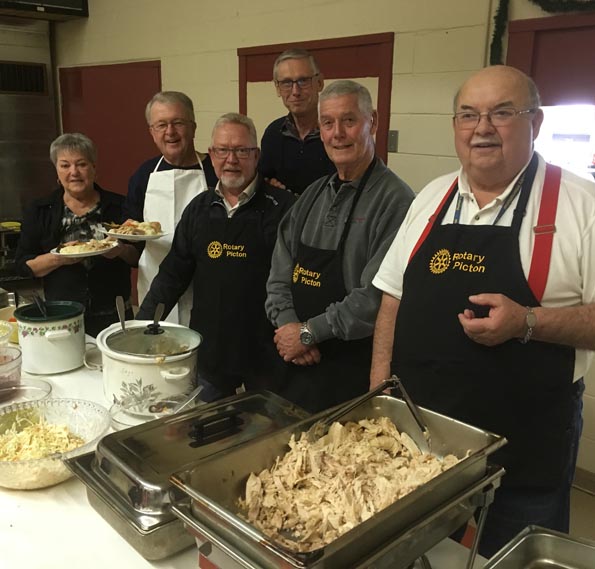 <p>Serving compassion From left: Ellen Snider, Rick Jones, Robert Quaiff, Grant Robinson, Doug Snider, and Bill Edwards serve the 20th annual Picton Salvation Army Loaves and Fishes Dinner. (Adam Bramburger/Gazette staff)</p>
