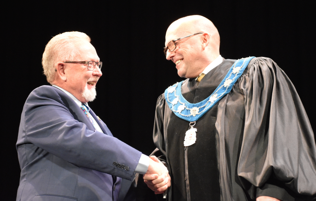 <p>A NEW DAY- Past Prince Edward County Mayor Robert Quaiff congratulates Mayor Steve Ferguson after installing the chain of office at the inaugural meeting of this term of Prince Edward County council at the Regent Theatre on Tuesday evening.  (Jason Parks/Gazette Staff)</p>
