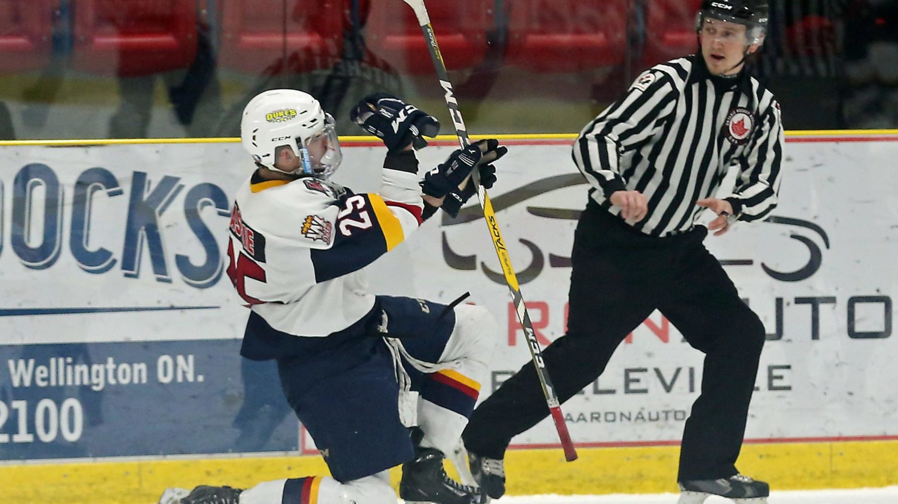 <p>MASSIVE EFFORT- OJHL Linesman Corey Mitchell scrambles to get out of the way as Dylan Massie celebrates his last second overtime winning marker that lifted the Wellington Dukes over the visiting Oakville Blades 6-5 at Lehigh Arena on Friday. (Ed McPherson/OJHL images)</p>
