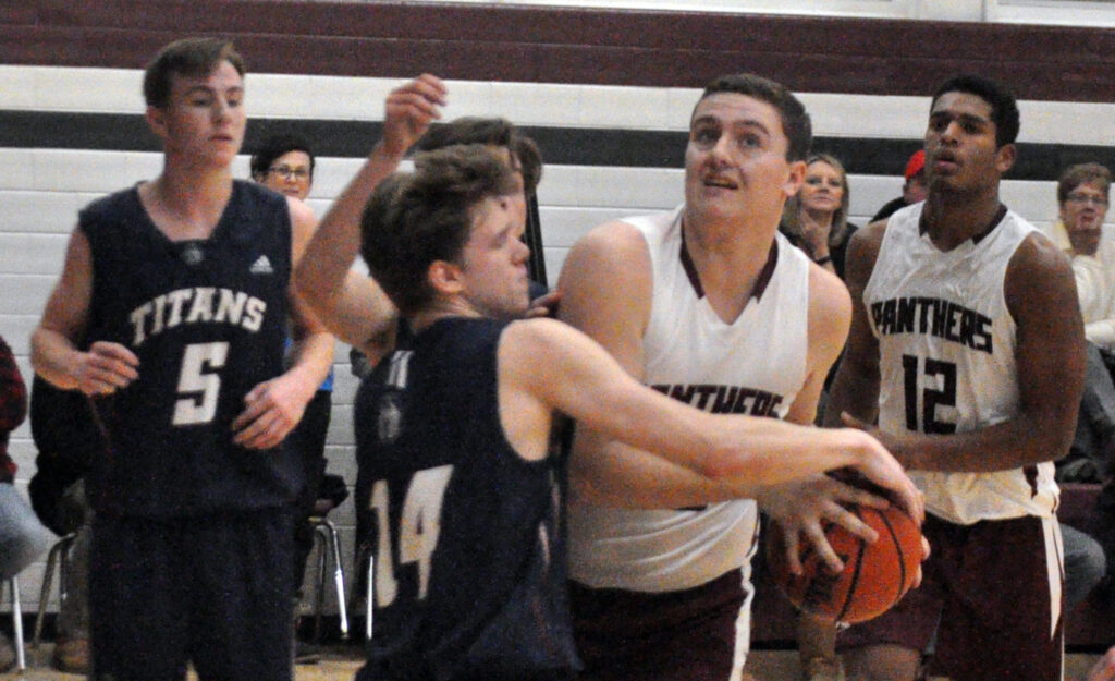 <p>Close contest – St. Theresa Titan Bailey Maracle tries to steal the ball from PECI Panther Brodie Byford Thursday as St. Theresa’s Aden Callahan and PECI’s Alex Arsenault look on. (Adam Bramburger/Gazette staff)</p>
