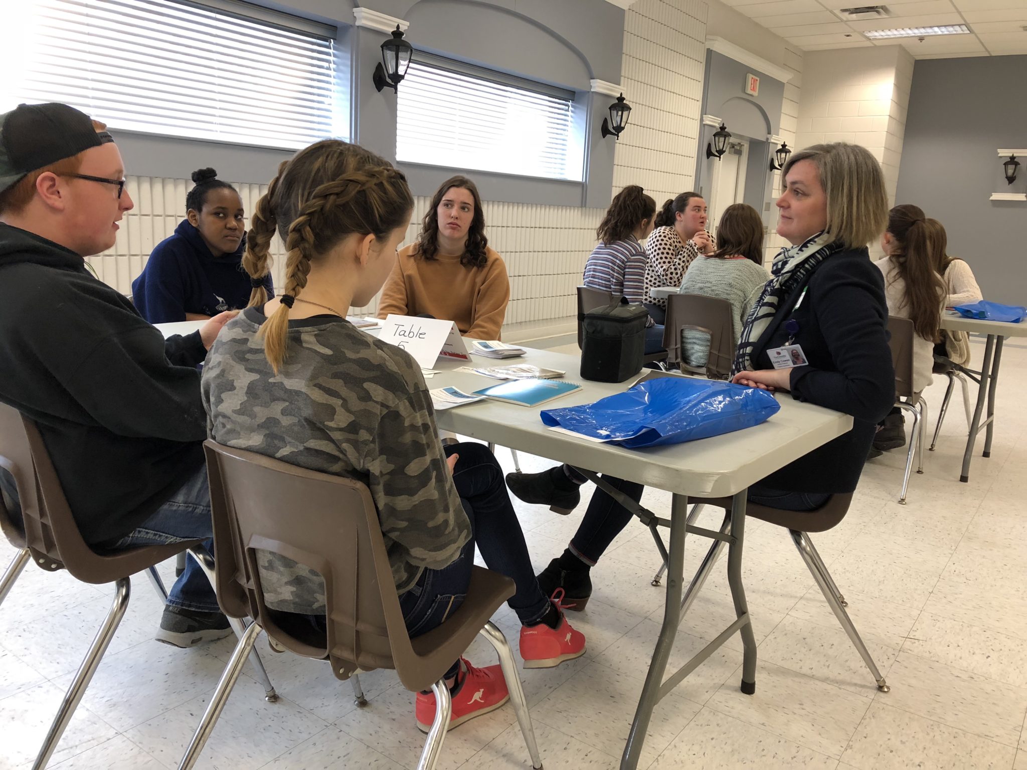 <p>(Right) County of Prince Edward Grants and Special Projects Coordinator Emily Cowan listens to Co-op and Careers students from PECI at the second annual CHAT symposium at Rotary Club of Picton Hall on Wednesday. (Jason Parks/Gazette Staff)</p>
