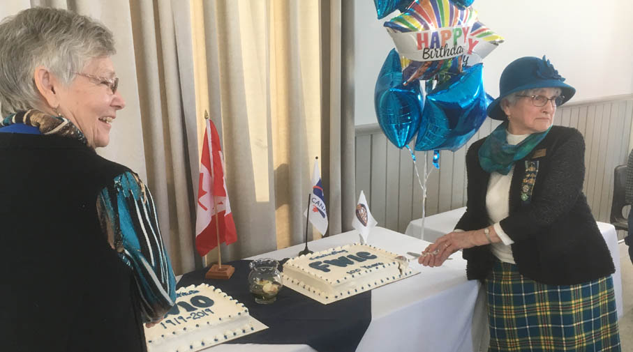 <p>Big milestone – Federated Women’s Institutes of Ontario president-elect Mary Shortt, left, and past-president and Prince Edward District Women’s Institute president Evelyn Peck cut cakes to celebrate 100 years of the Federated Women’s Institute in Ontario and Canada Tuesday afternoon. (Adam Bramburger/Gazette staff)</p>
